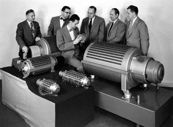 Men looking at old data storage